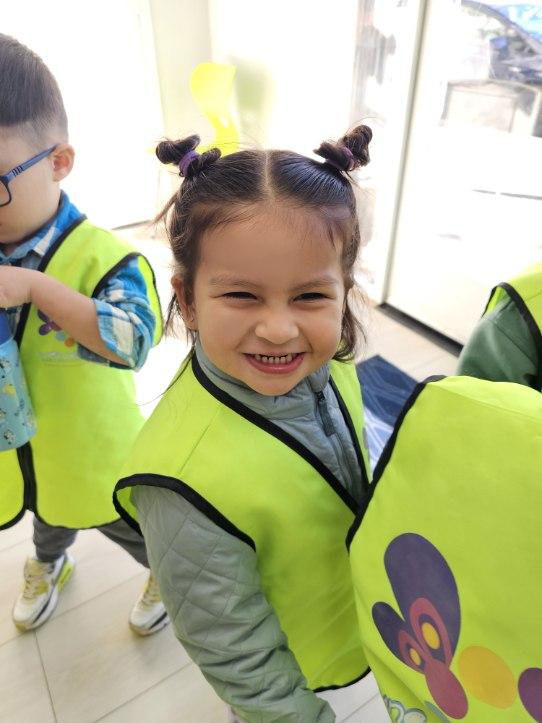 Children working at the dedicated art area with open-ended materials and natural light